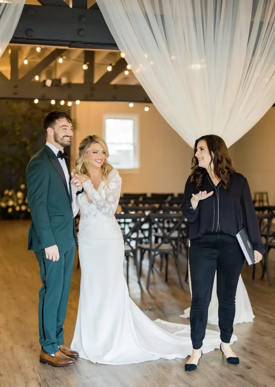 Richelle Norman speaking with a couple inside TRAINE at Seaboard Station